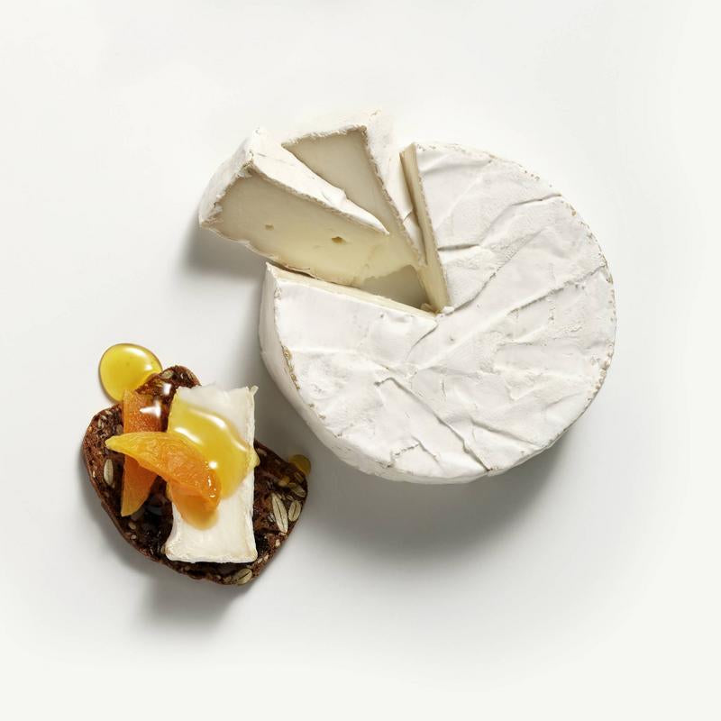 Woolwich Dairy Triple Cream Goat Brie on a raincoast cracker with dried apricot and honey.