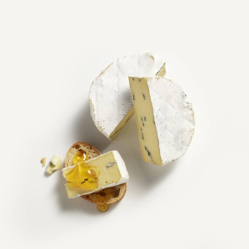 Alexis de Portneuf Caronzola Cheese on a crispy bread with honey