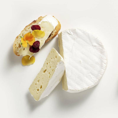 Alexis de Portneuf Brie D'Alexis Double Cream Cheese on a  baguette with dried fruits