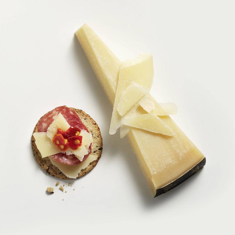 Saputo Bella Lodi Cheese on top of cracker with charcuterie